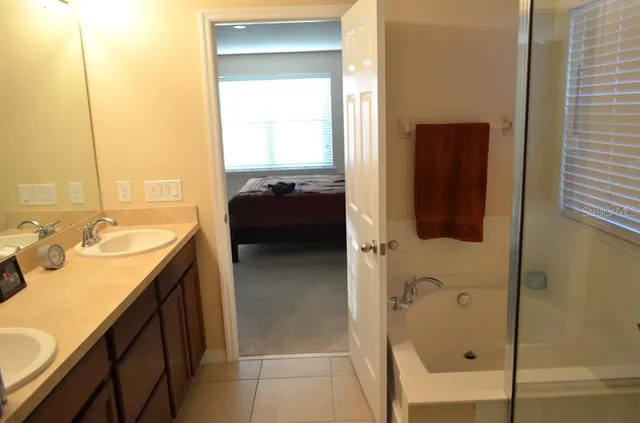 a bathroom with a bathtub and shower