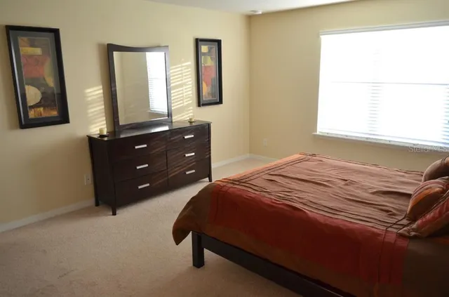 a view of a brick building next to a yard