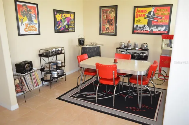 a dining room with furniture and window