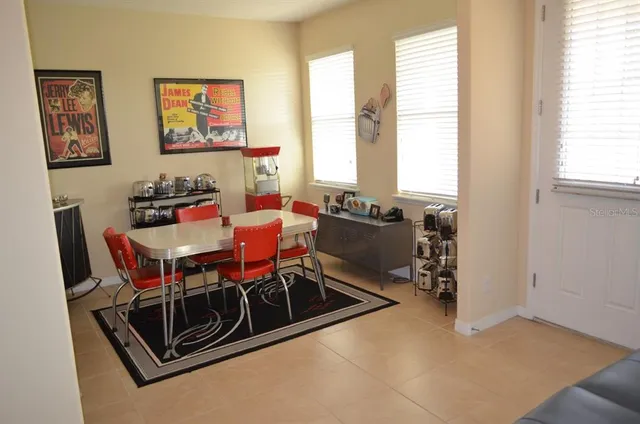 a kitchen with a stove a sink and a refrigerator