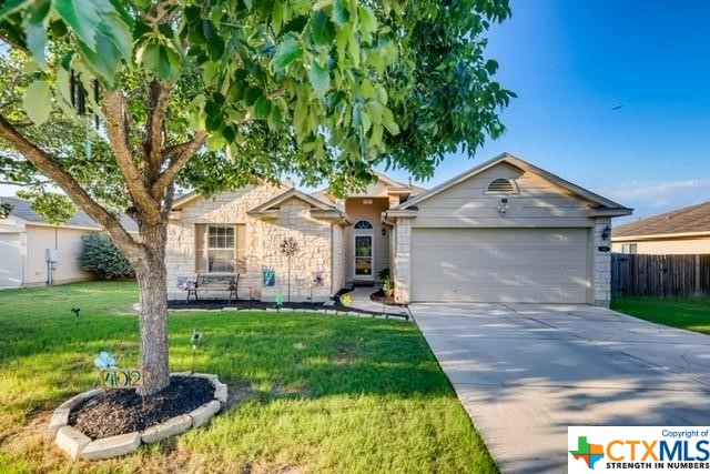 402 Atlantis Kyle, TX 78640 - Photo 1 of 1 a front view of a house with a yard and garage