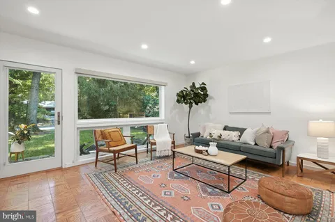 a spacious bedroom with a bed and window