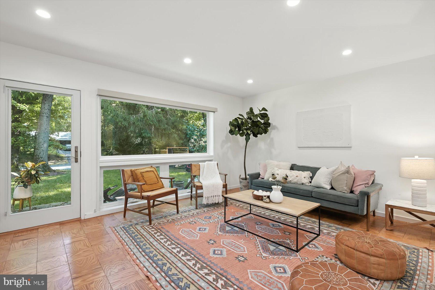8216 Fenway Road Bethesda, MD 20817 - Photo 14 of 65 a living room with furniture and a large window