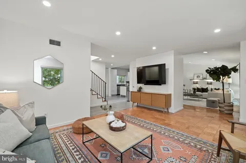 a bathroom with a tub and shower