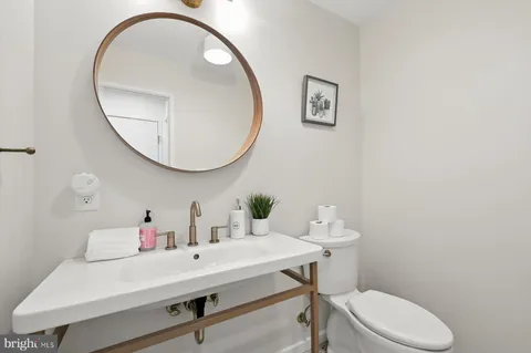 a bathroom with a sink double vanity granite tub and shower