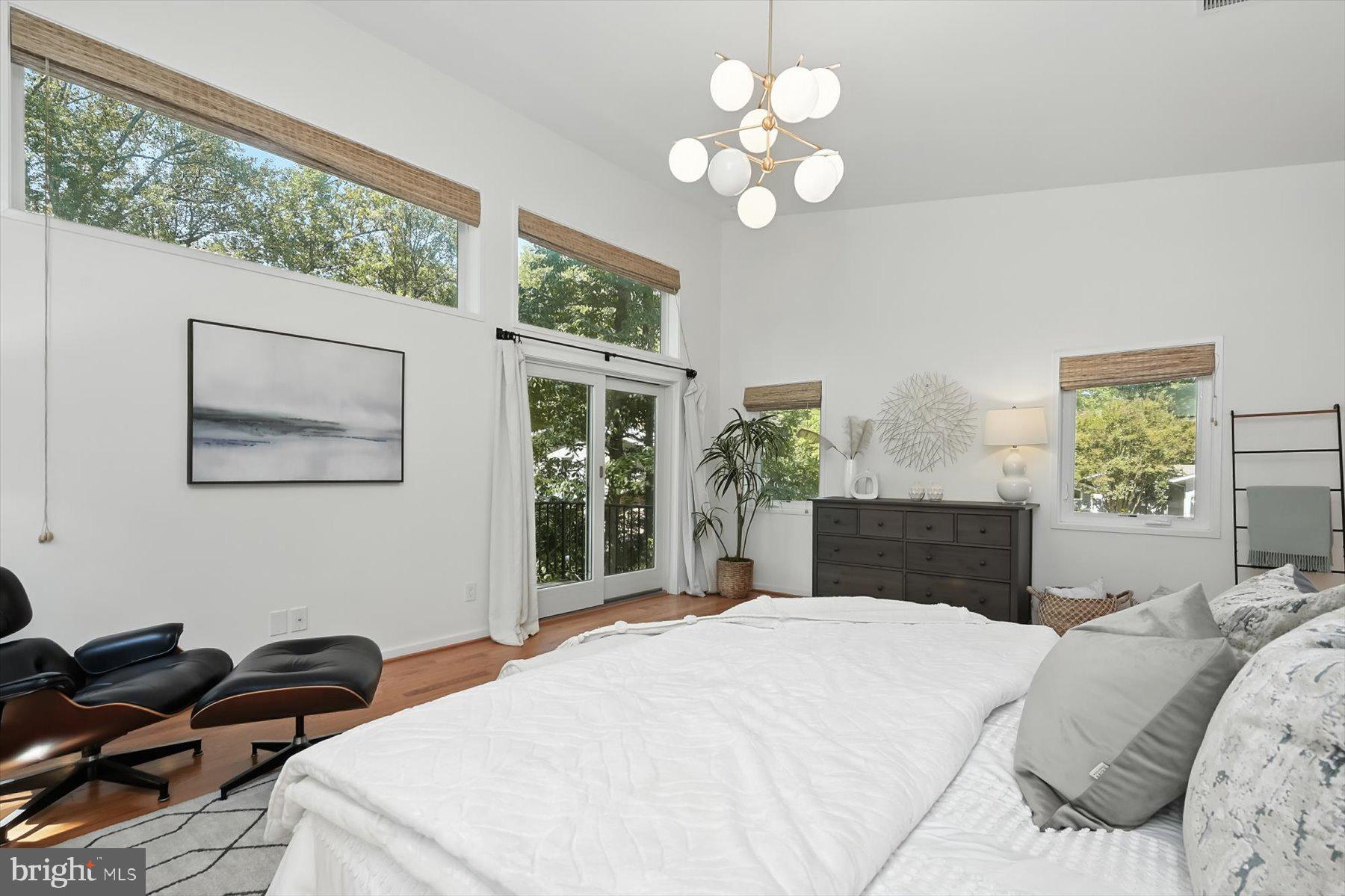 8216 Fenway Road Bethesda, MD 20817 - Photo 20 of 65 a bedroom with a bed painting on wall and a large window