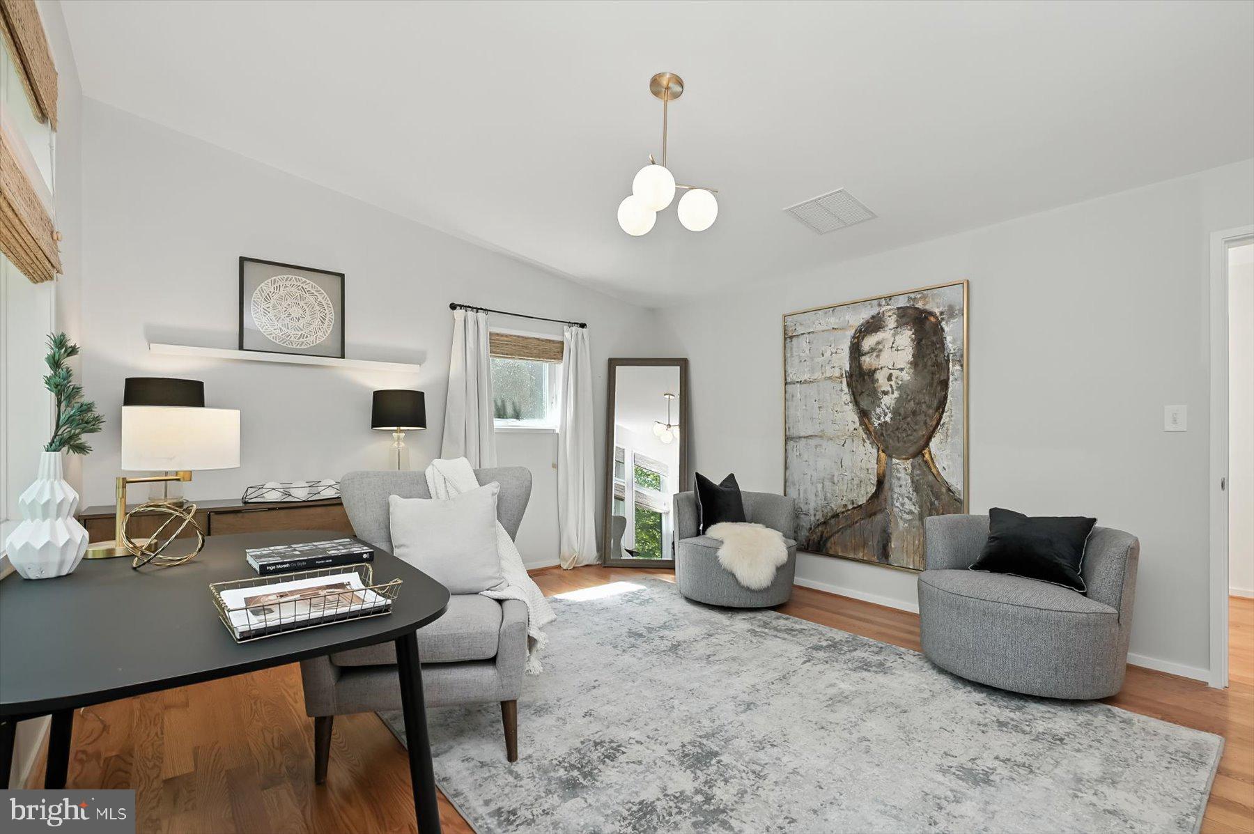 8216 Fenway Road Bethesda, MD 20817 - Photo 29 of 65 a living room with furniture and wooden floor