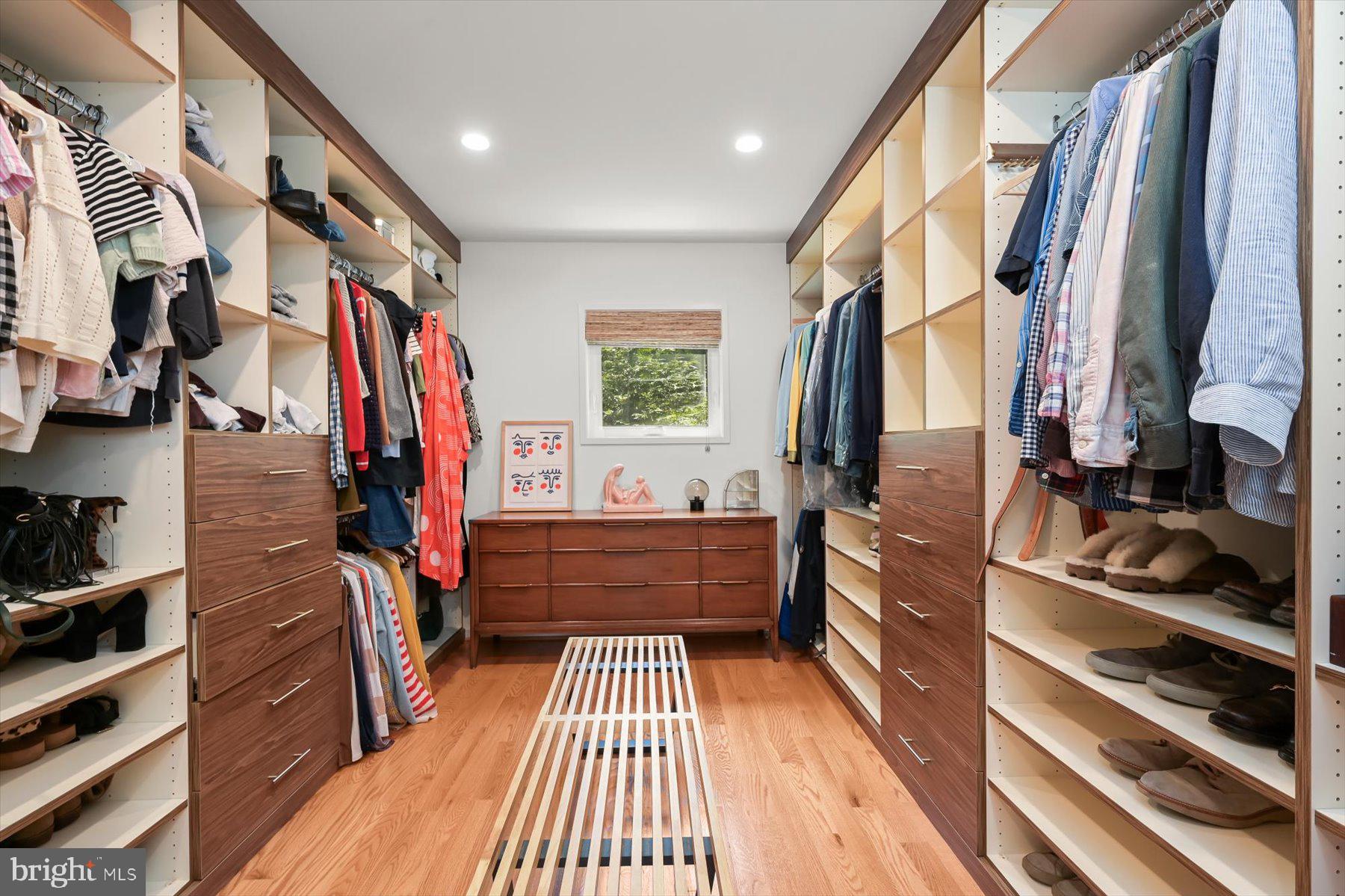 8216 Fenway Road Bethesda, MD 20817 - Photo 31 of 65 a view of walk in closet with clothes and shoes