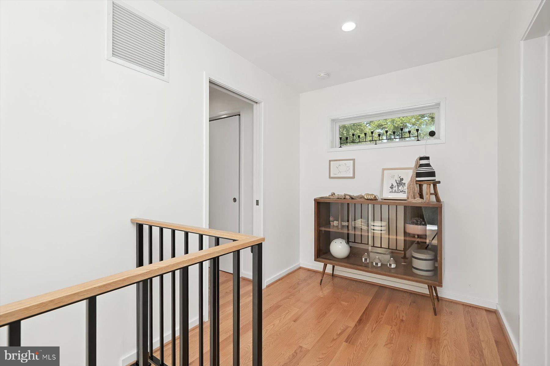8216 Fenway Road Bethesda, MD 20817 - Photo 32 of 65 a view of an empty room with wooden floor