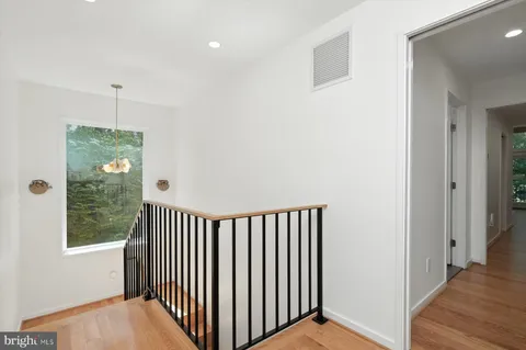 a living room with furniture window and wooden floor