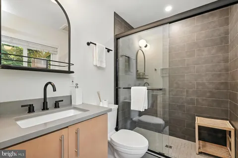 a view of a patio with table and chairs with wooden floor and fence