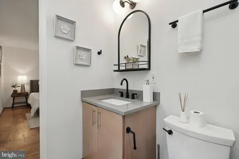 a view of a house with a patio and a yard