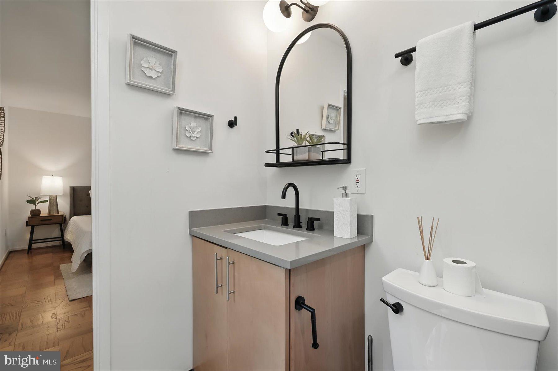 8216 Fenway Road Bethesda, MD 20817 - Photo 38 of 65 a bathroom with a sink and a toilet