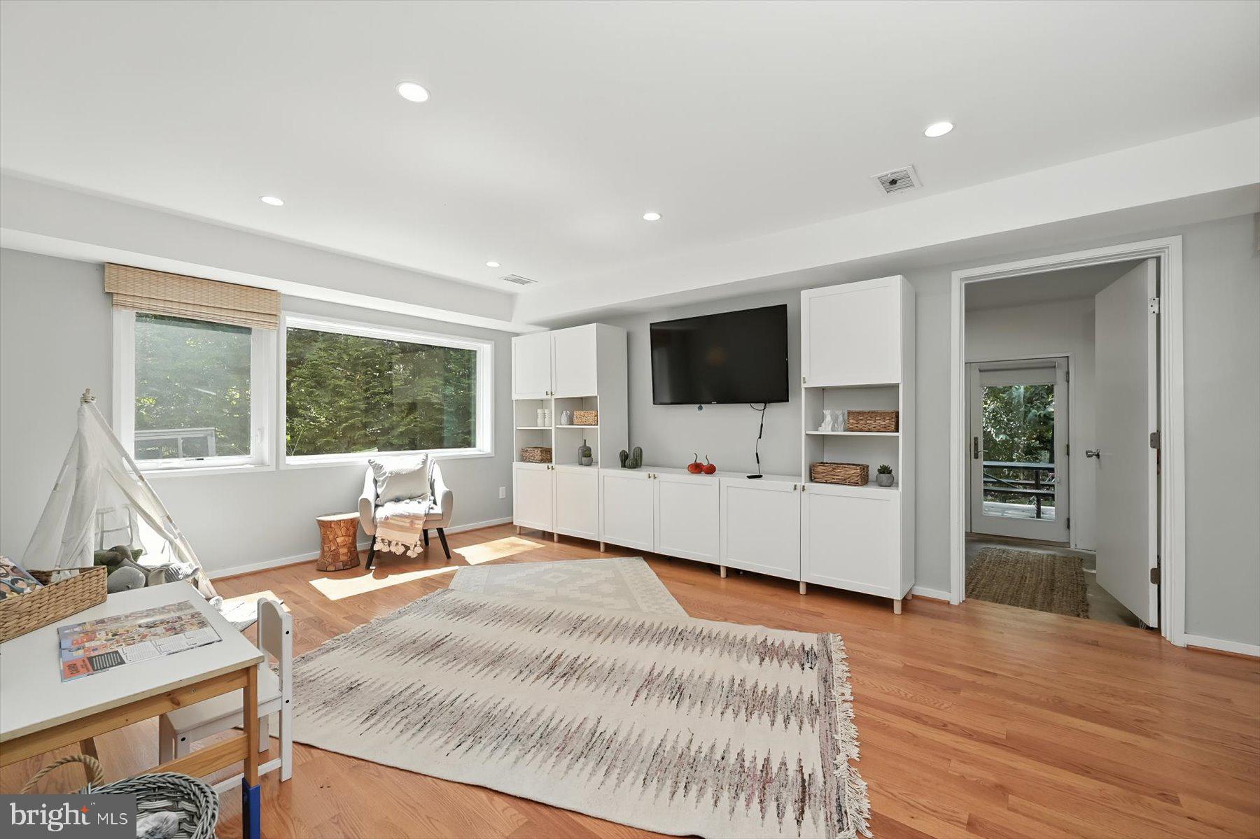 8216 Fenway Road Bethesda, MD 20817 - Photo 43 of 65 a living room with furniture and a flat screen tv