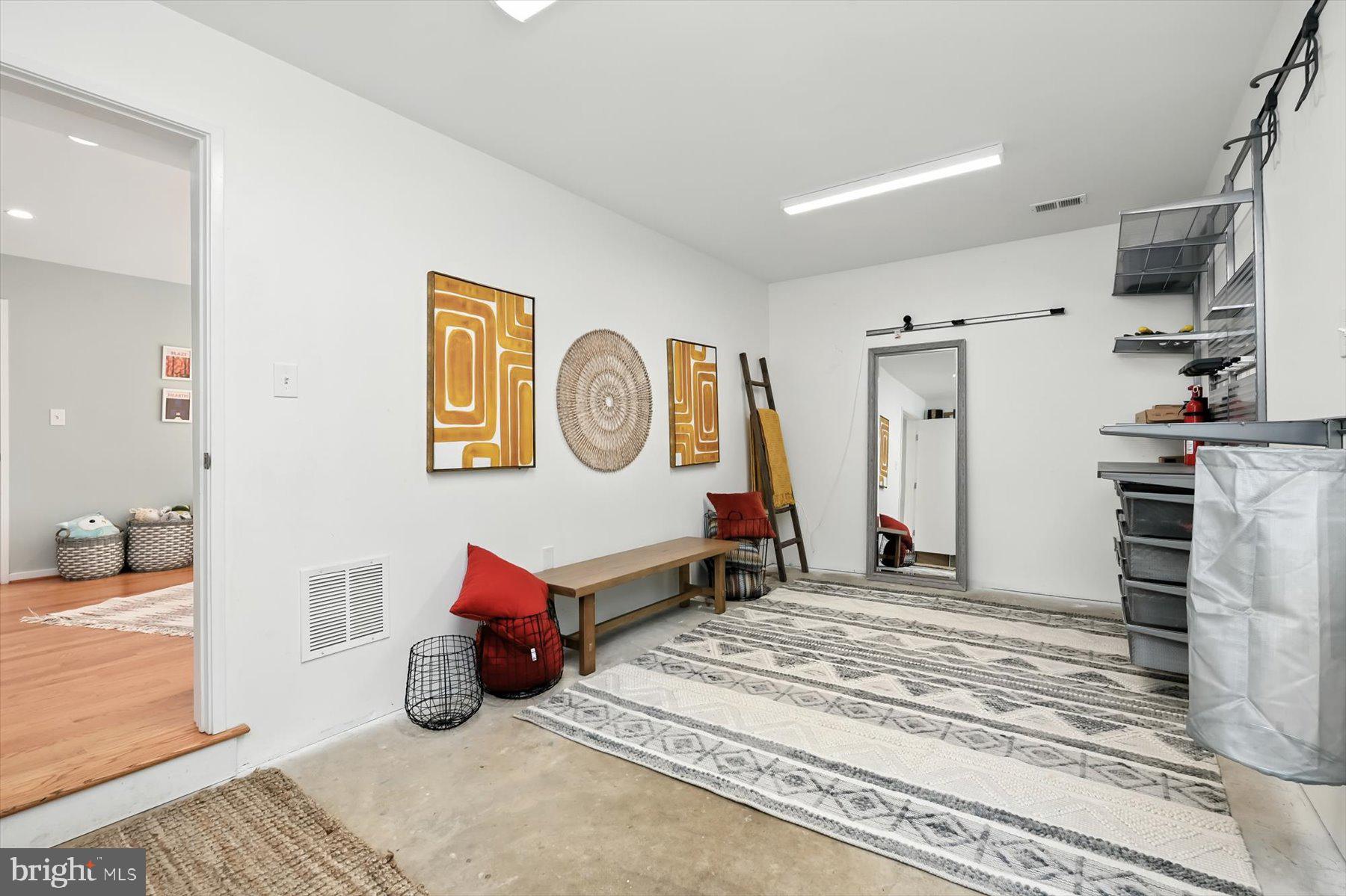 8216 Fenway Road Bethesda, MD 20817 - Photo 45 of 65 a bedroom with furniture and a chandelier