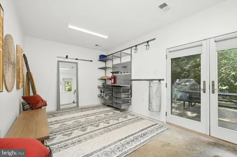 a view of backyard with swimming pool and patio