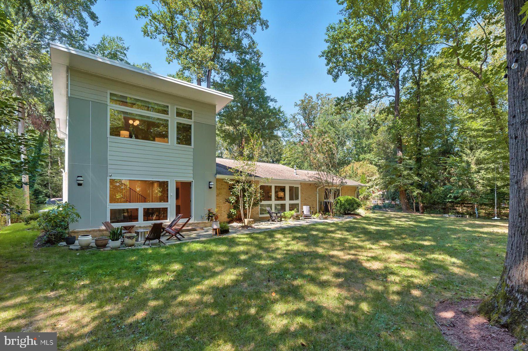 8216 Fenway Road Bethesda, MD 20817 - Photo 47 of 65 a front view of a house with a yard