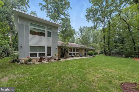 a view of a couches in backyard of house