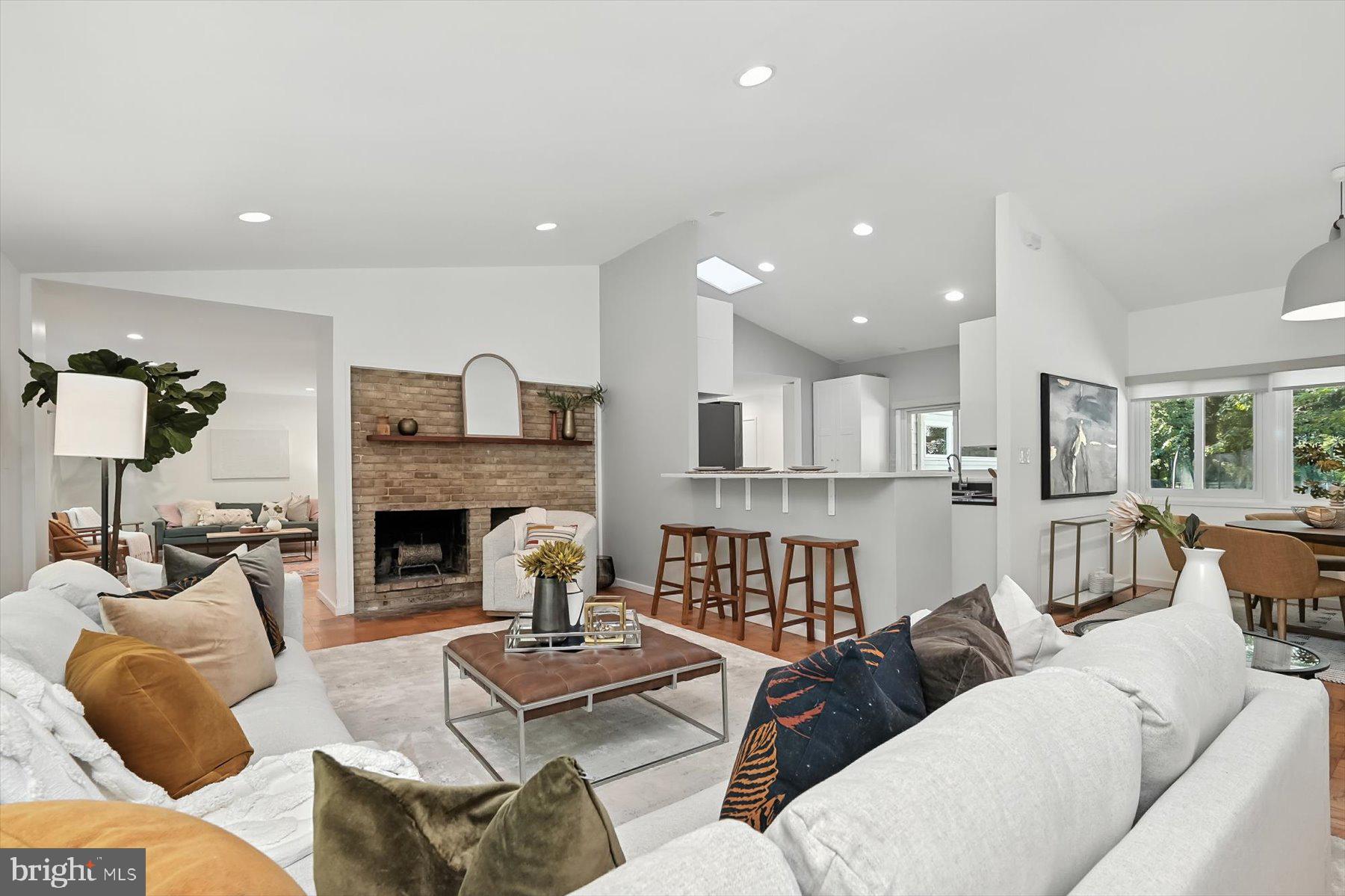 8216 Fenway Road Bethesda, MD 20817 - Photo 5 of 65 a living room with furniture and a fireplace
