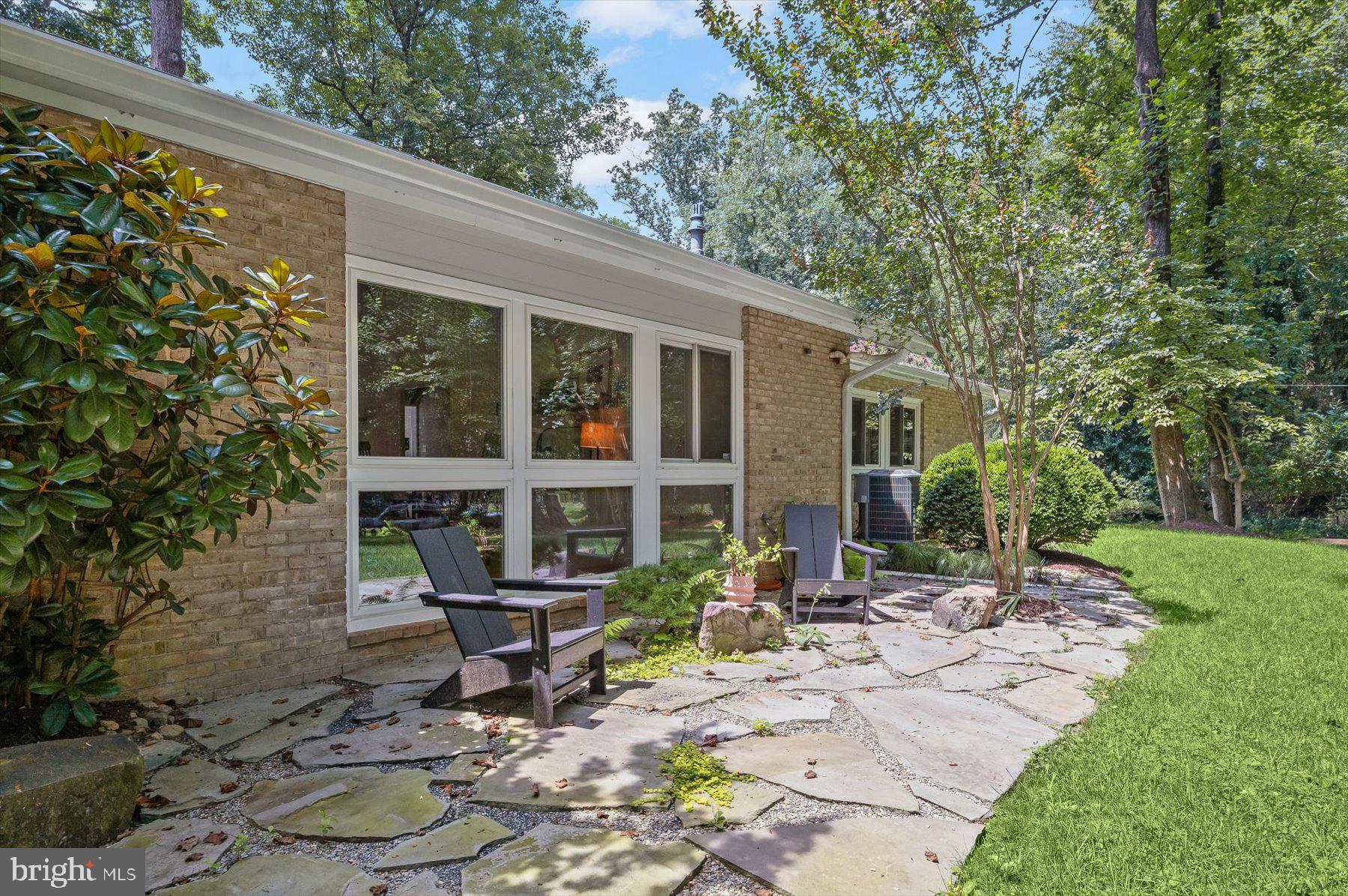 8216 Fenway Road Bethesda, MD 20817 - Photo 51 of 65 a front view of a house with garden