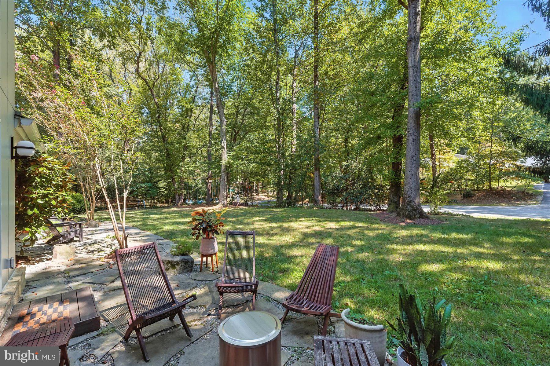 8216 Fenway Road Bethesda, MD 20817 - Photo 53 of 65 a view of a chairs and table in the garden
