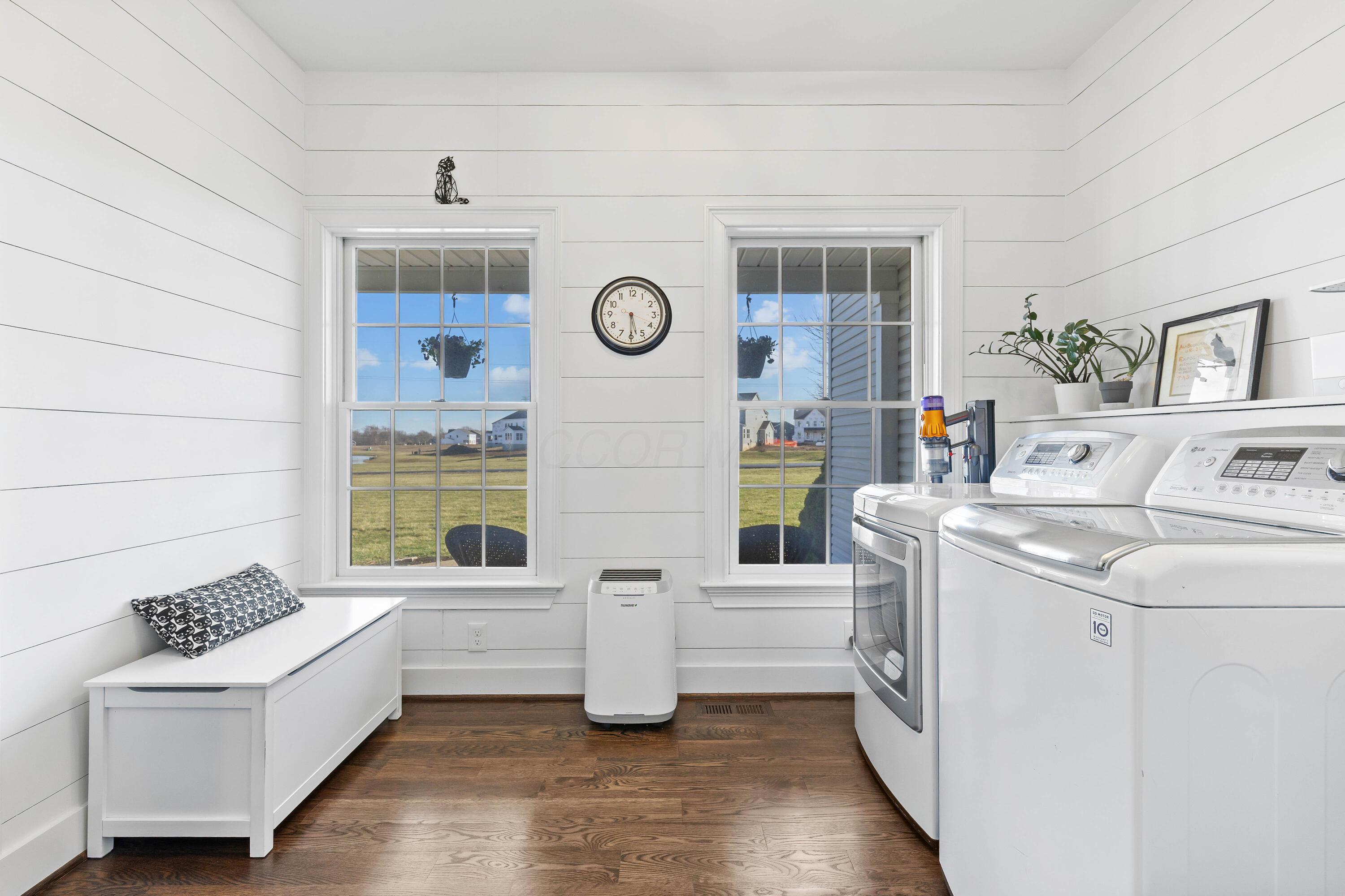 1364 Dale Ford Road Delaware, OH 43015 - Photo 9 of 112 • Hardwood flooring • Shiplap walls • Lighted ceiling fan • Utility sink • Washer & dryer are negotiable • Electric dryer hookup • Wall hooks • Pocket door