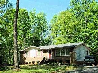 4282 Hurdle Road Roxboro, NC 27573 - Photo 1 of 1 a front view of a house with a yard