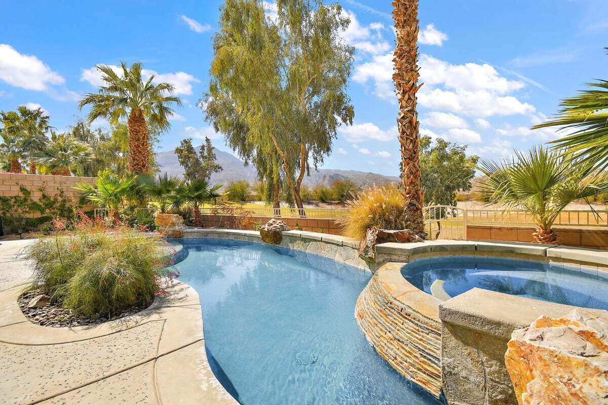 a view of a swimming pool with lounge chair