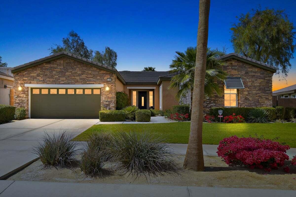 81086 Barrel Cactus Road La Quinta, CA 92253 - Photo 11 of 36 a front view of a house with a yard and garage