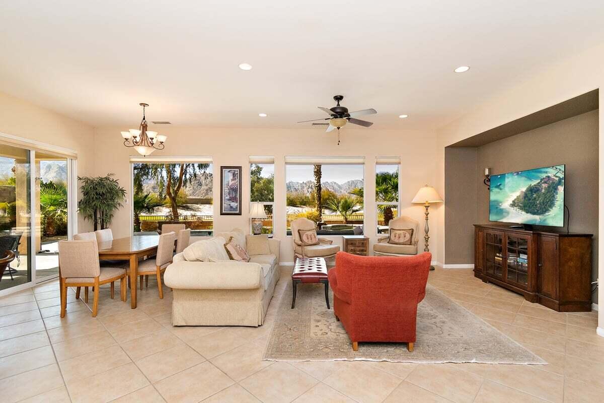 81086 Barrel Cactus Road La Quinta, CA 92253 - Photo 14 of 36 a living room with furniture and a flat screen tv