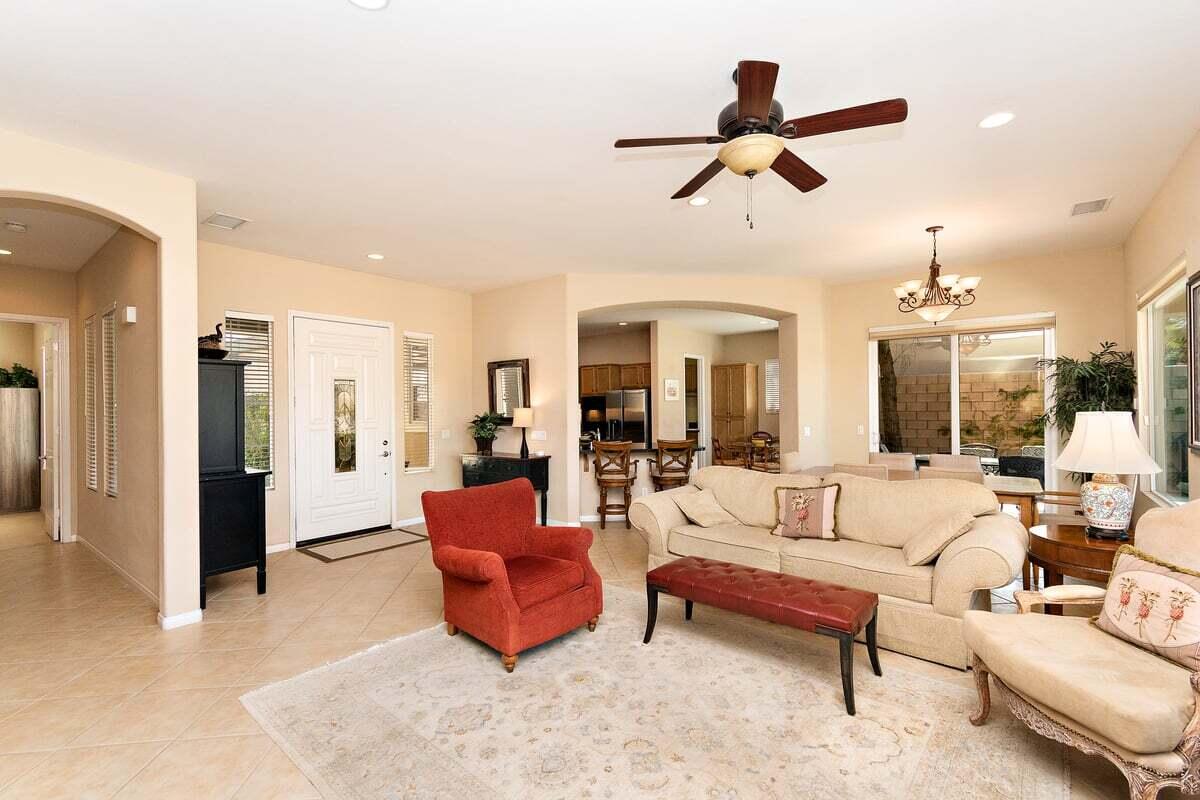 81086 Barrel Cactus Road La Quinta, CA 92253 - Photo 16 of 36 a living room with furniture and a chandelier