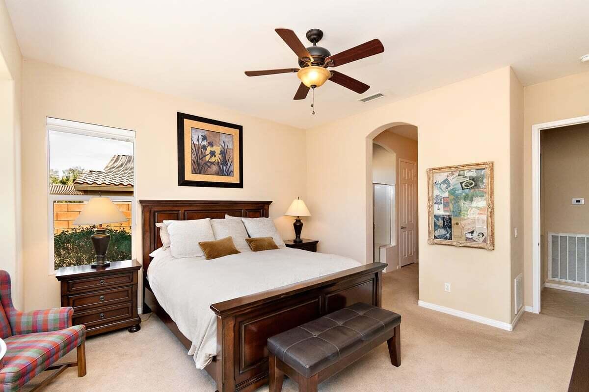 81086 Barrel Cactus Road La Quinta, CA 92253 - Photo 26 of 36 a bedroom with furniture and a large window