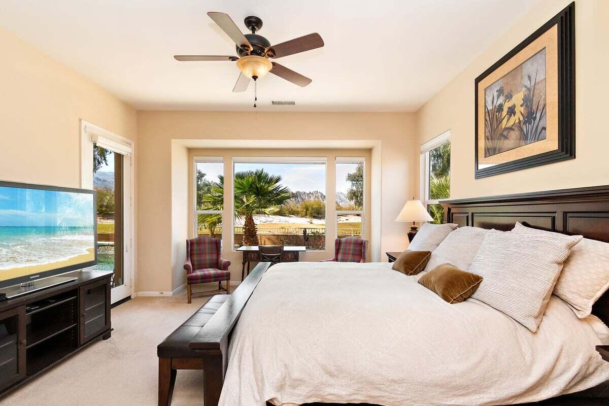 81086 Barrel Cactus Road La Quinta, CA 92253 - Photo 27 of 36 a bedroom with a bed and a large window