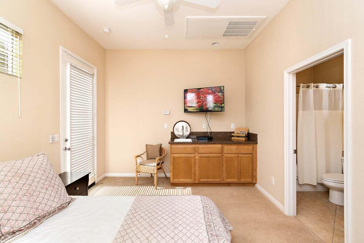 81086 Barrel Cactus Road La Quinta, CA 92253 - Photo 33 of 36 a view of a bedroom with a bed and a tv