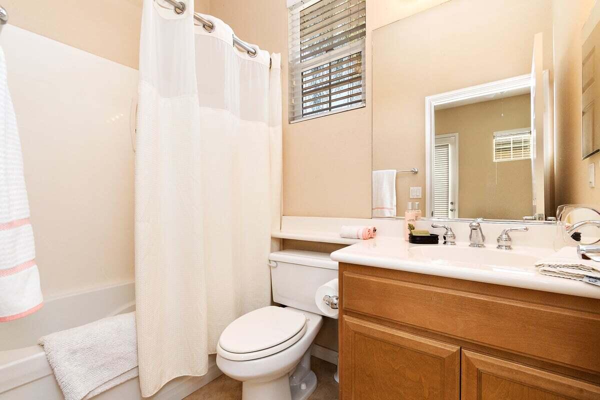 81086 Barrel Cactus Road La Quinta, CA 92253 - Photo 34 of 36 a bathroom with a sink toilet and mirror