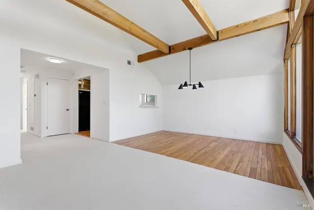 a view of livingroom with hardwood floor and fireplace