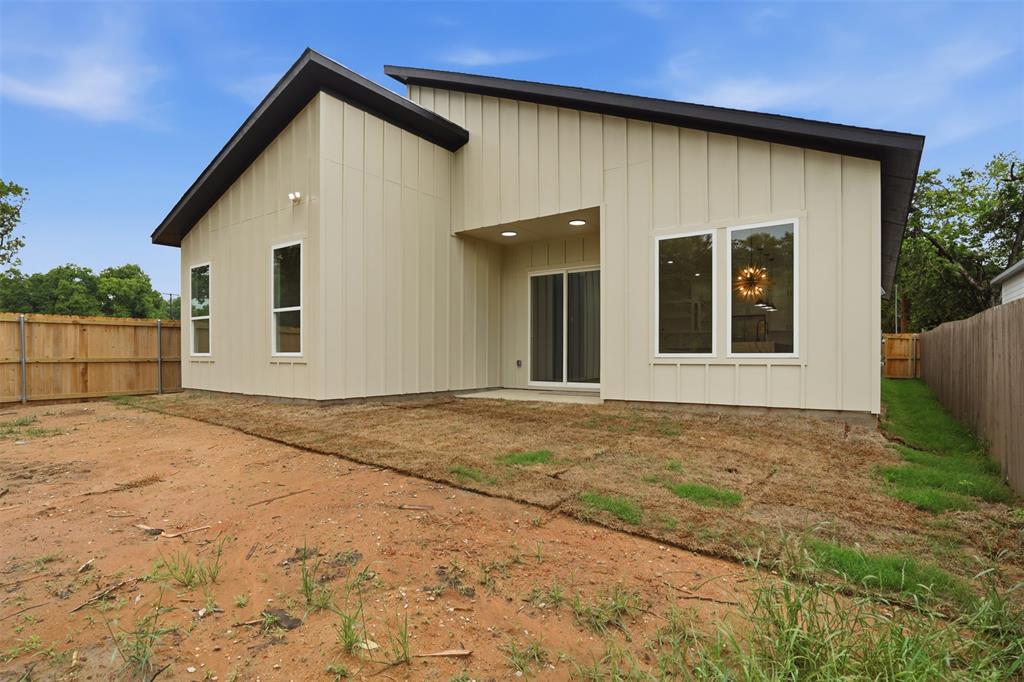 1111 Riverwood Road Dallas, TX 75217 - Photo 4 of 40 Contemporary exterior featuring vertical siding in contrasting dark and light tones