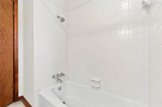 a bathroom with a white bath tub