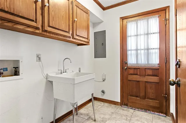 a kitchen with stainless steel appliances granite countertop a sink and cabinets