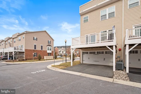 a front view of a building with parking