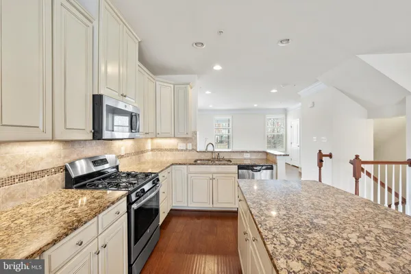a kitchen with lots of counter top space and appliances