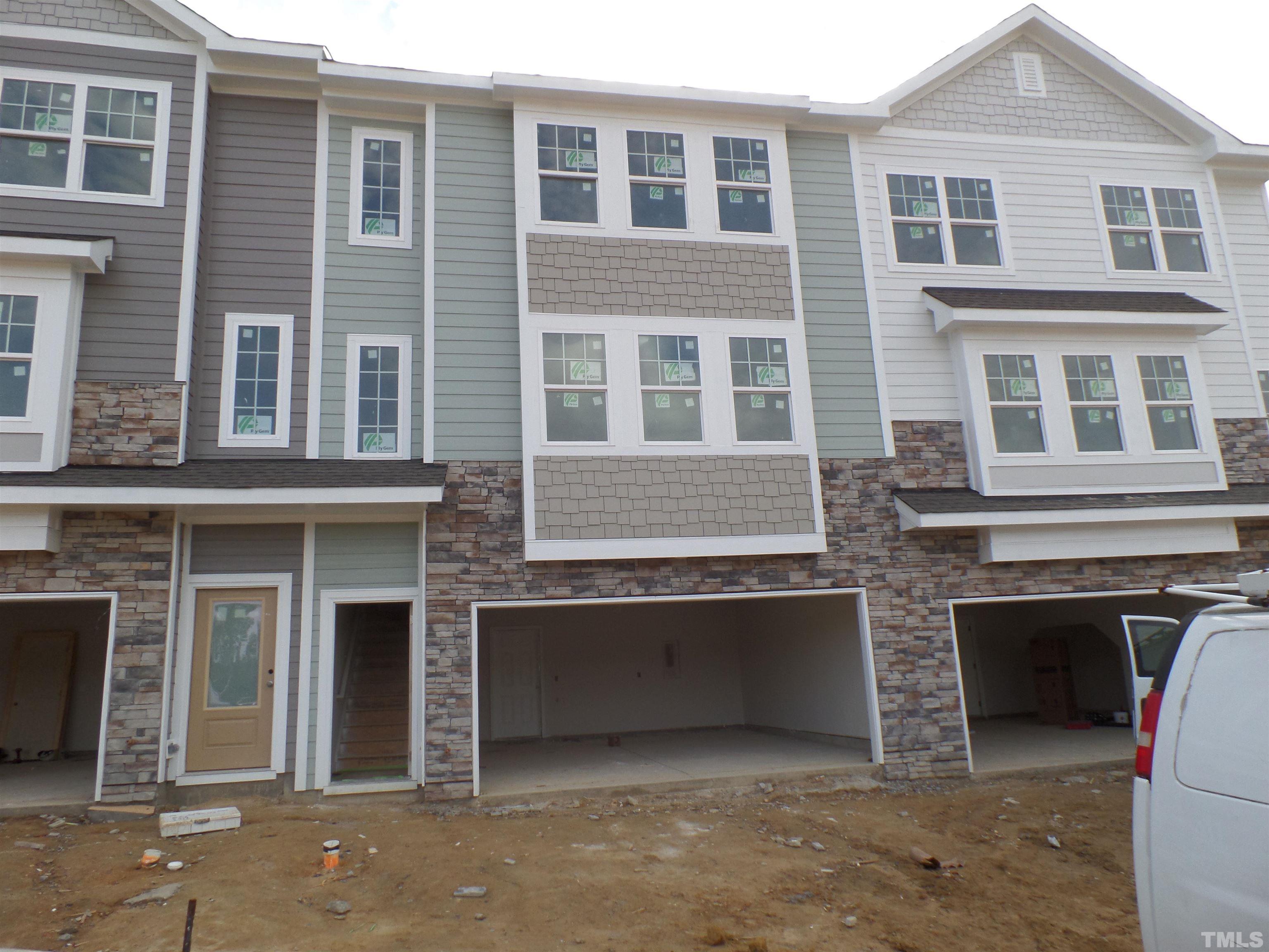 6912 Point Bar Place Raleigh, NC 27616 - Photo 1 of 26 a front view of a house with many windows