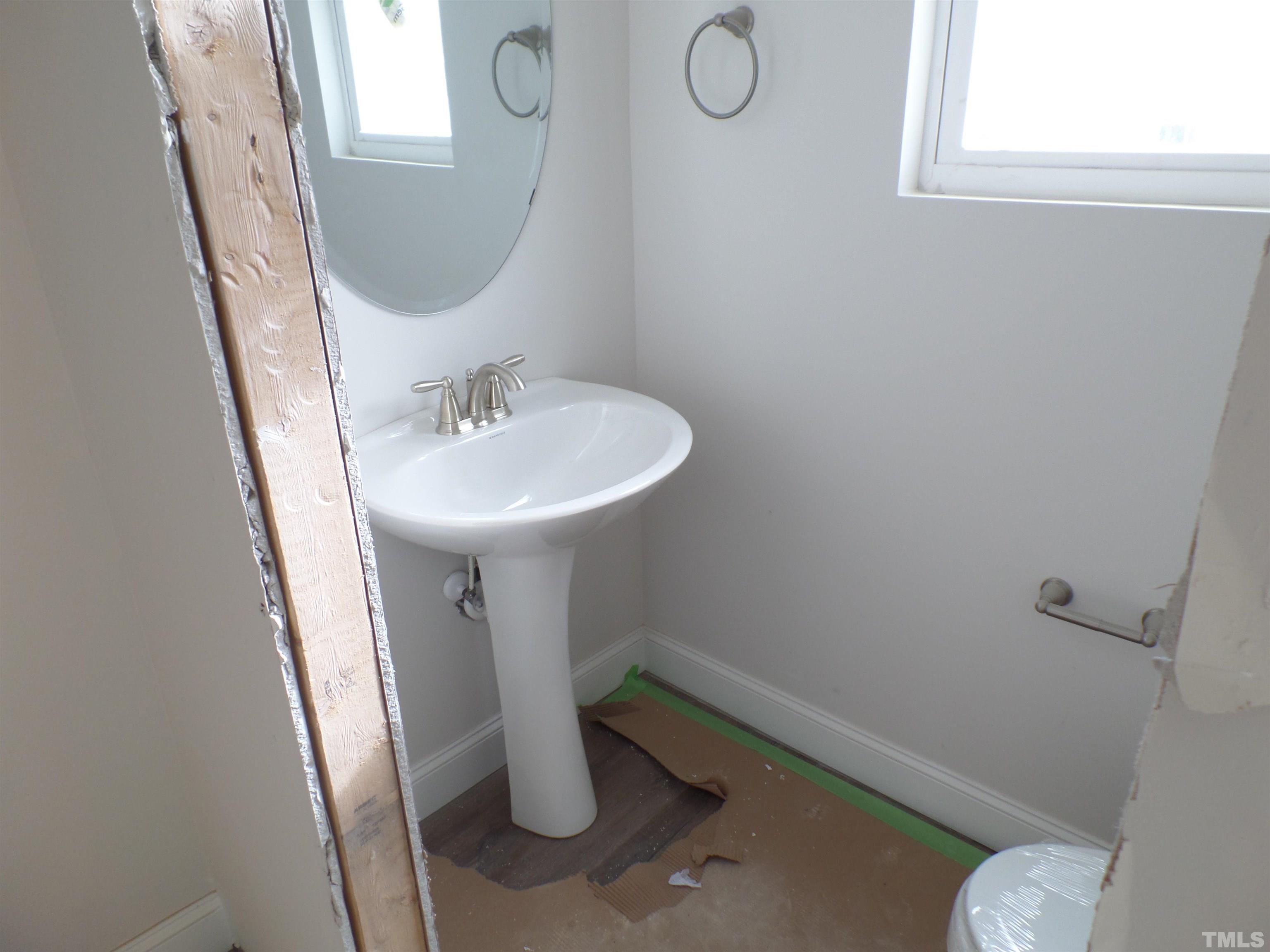 6912 Point Bar Place Raleigh, NC 27616 - Photo 12 of 26 a bathroom with a sink and mirror
