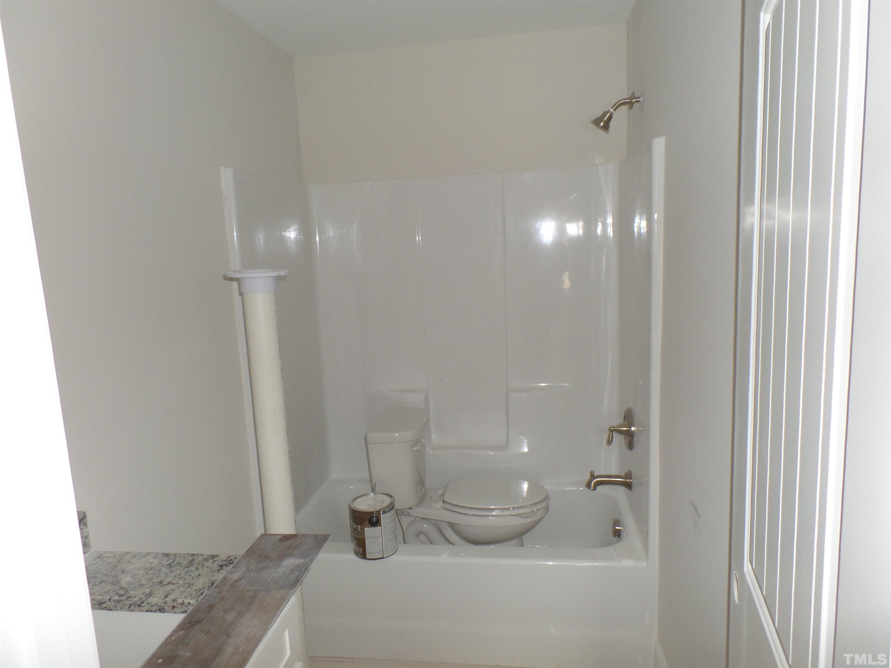 6912 Point Bar Place Raleigh, NC 27616 - Photo 16 of 26 a bathroom with a sink and a mirror