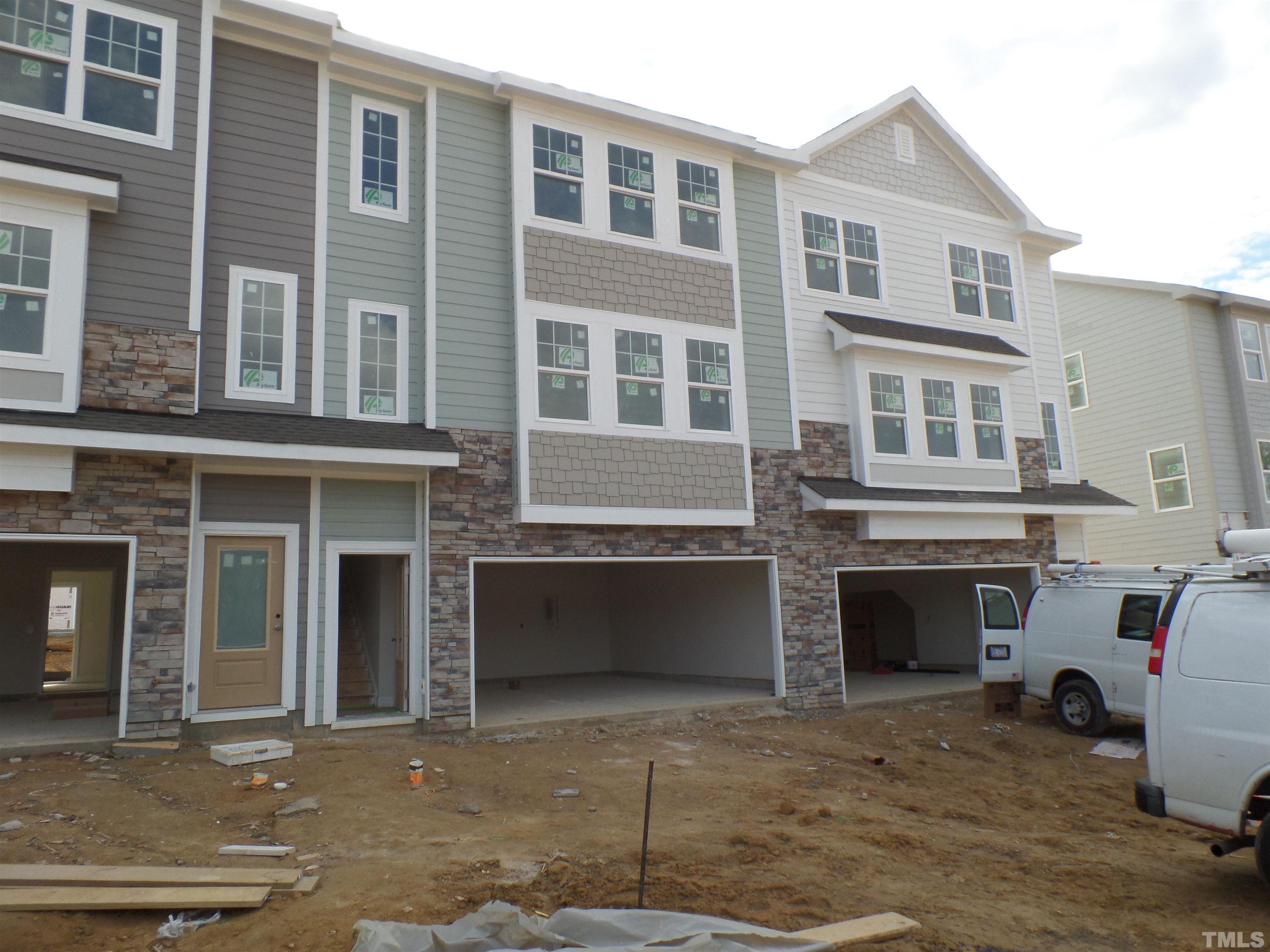 6912 Point Bar Place Raleigh, NC 27616 - Photo 2 of 26 a front view of a house with many windows