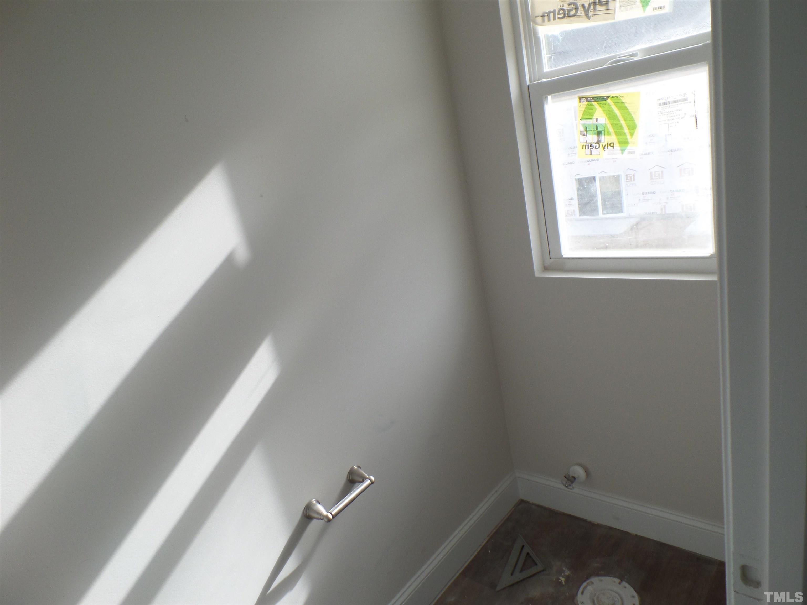 6912 Point Bar Place Raleigh, NC 27616 - Photo 22 of 26 a small space with window and mirror
