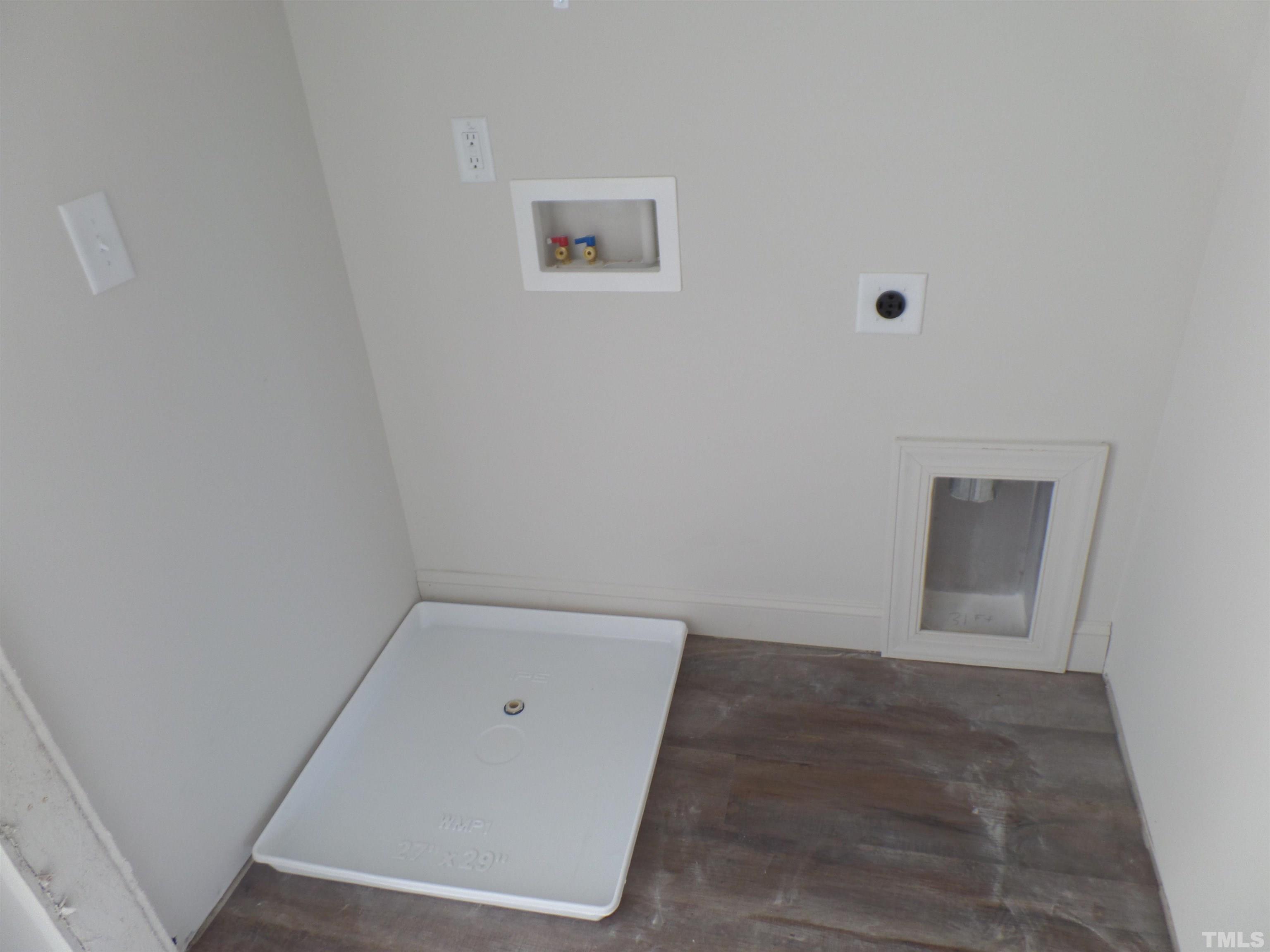 6912 Point Bar Place Raleigh, NC 27616 - Photo 23 of 26 an empty room with a hallway