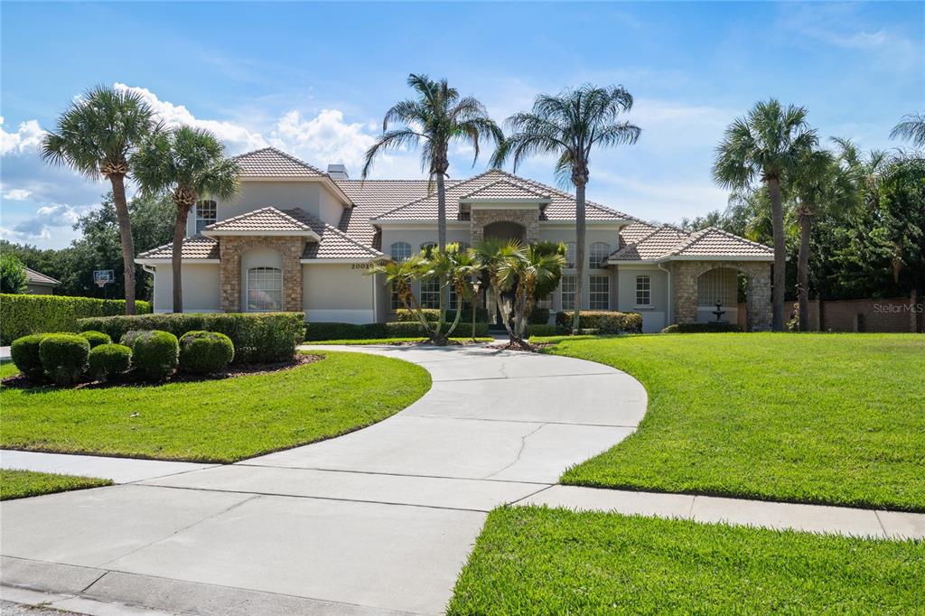 2002 Water Key Drive Windermere, FL 34786 - Photo 2 of 60 a front view of house with yard and green space
