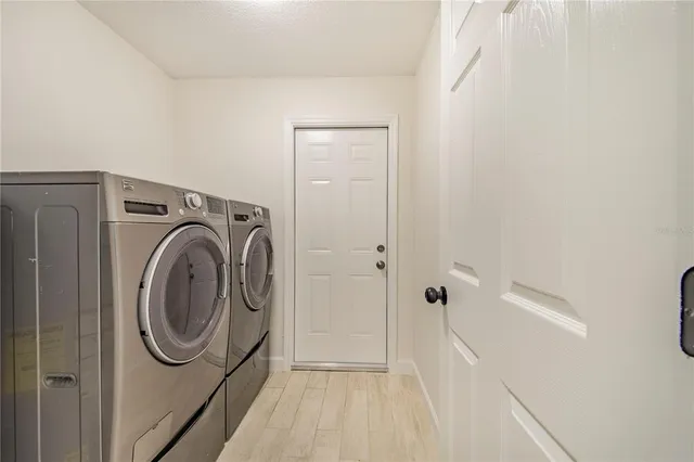 a utility room with dryer and washer