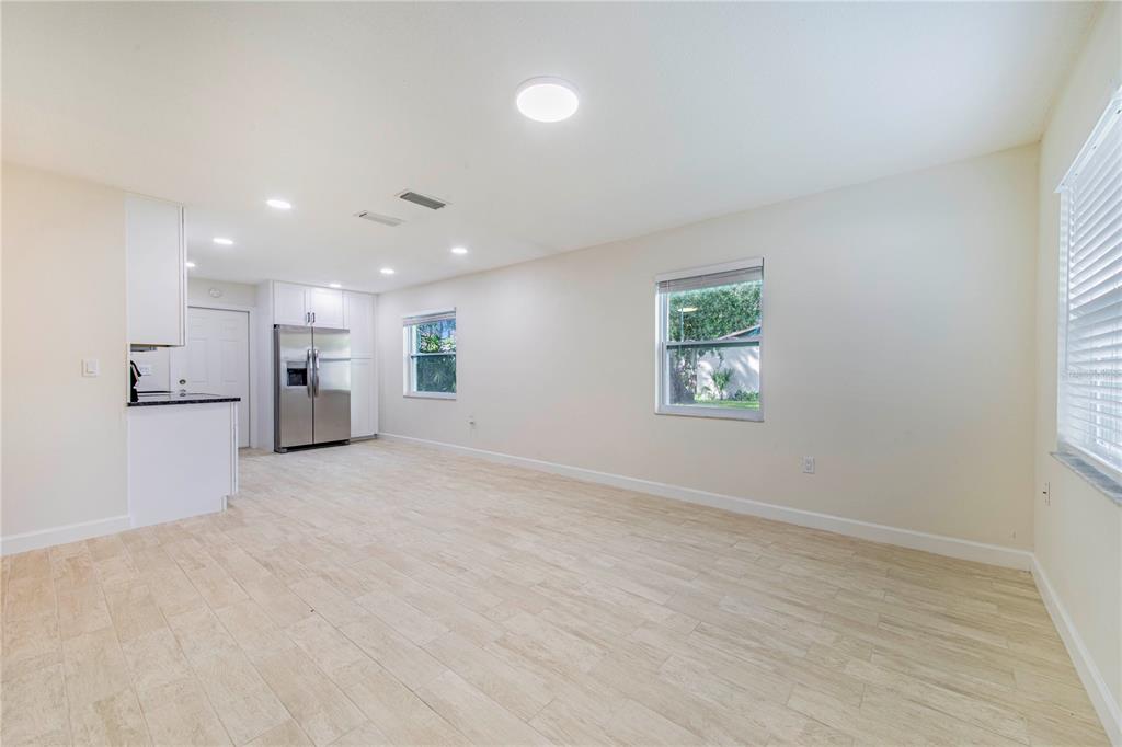 1221 Hartsell Avenue Lakeland, FL 33803 - Photo 5 of 17 an empty room with kitchen view and window
